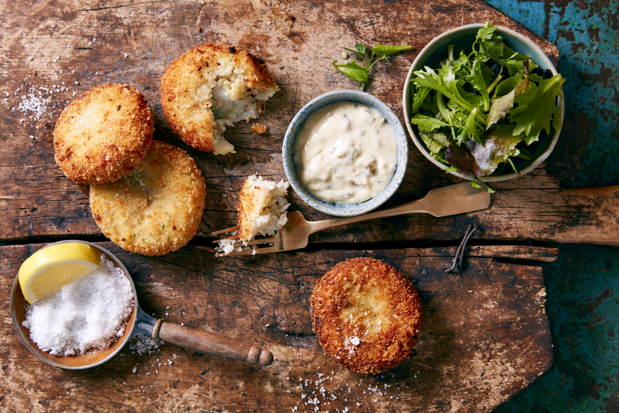 A photograph of Homemade fishcakes with tartare sauce